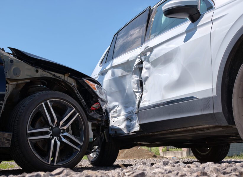 Cars crashed heavily in road accident after collision on city street. Road safety and insurance concept